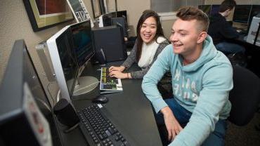 students analyzing data at a computer